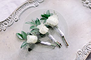 White Rose Boutonnieres on a Tray