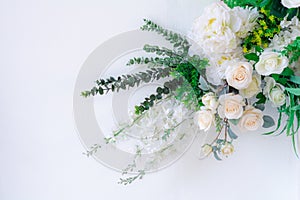 White rose and green leaves on a white background. Wedding backdrop, love ceremony, Beautiful flower or flora, valentine day