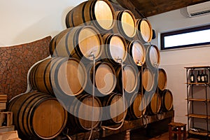 White, rose and red dry and sweet wines in big and small barrels for sale in wine cellars in Italy photo