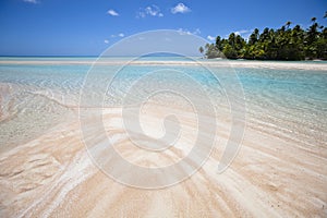 White and rose sand beach with blue lagoon