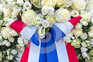 White roses and the national dutch flag from Netherlands
