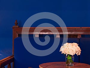 White roses on a wooden table