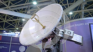 White rotating satellite dish antenna using to receive or transmit information