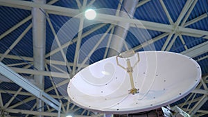 White rotating satellite dish antenna using to receive or transmit information