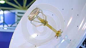 White rotating satellite dish antenna using to receive or transmit information