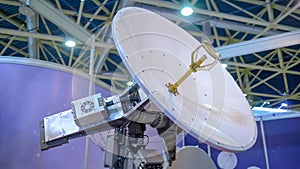 White rotating satellite dish antenna using to receive or transmit information