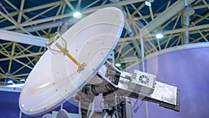 White rotating satellite dish antenna using to receive or transmit information