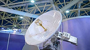 White rotating satellite dish antenna using to receive or transmit information