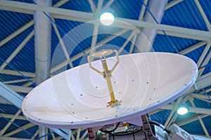 White rotating satellite dish antenna using to receive or transmit information