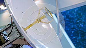 White rotating satellite dish antenna using to receive or transmit information