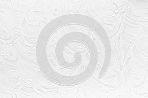 White rough dry plaster texture with curly curved lines as simple abstract background.