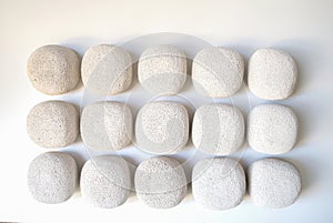 The white round concrete blocks resemble many stones arranged