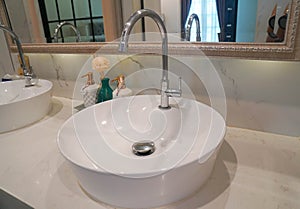 white round marble washbasin in luxury hotel bathroom