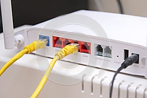 White router includes two yellow cable connectors rg45, home route