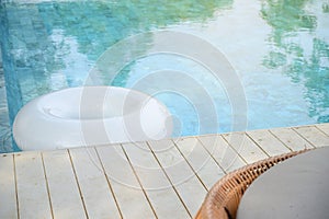 white rubber ring float in the swimming pool, relaxation time