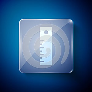 White Ruler icon isolated on blue background. Straightedge symbol. Square glass panels. Vector Illustration