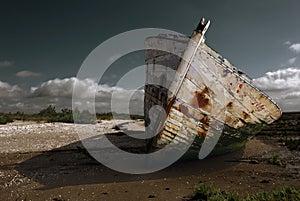 White rusty prow on the beach