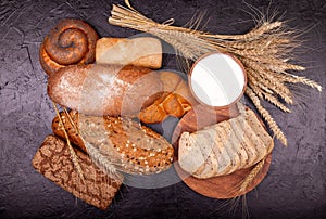 White and rye bread,rolls and cream close-up. Composition with breads.