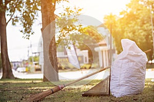 White sacks are used to contain dead leaves that have fallen seasonally in spring as way to clean park and mix leaves to make