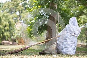 White sacks are used to contain dead leaves that have fallen seasonally in spring as way to clean park and mix leaves to make