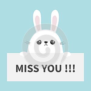 White sad bunny rabbit hanging on paper board Miss you. Funny head face. Big ears. Cute cartoon character. Kawaii animal. Easter s