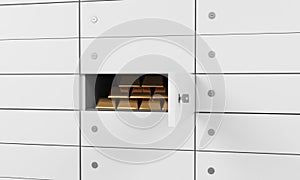 White safe deposit boxes in a bank. There are gold bullions inside of a one box. A concept of storing of important documents or va