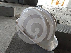 White safety helmet for the site engineer at the construction site