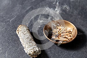 White sage and cup with smoking matches