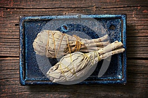 White sage incense on the plank photo