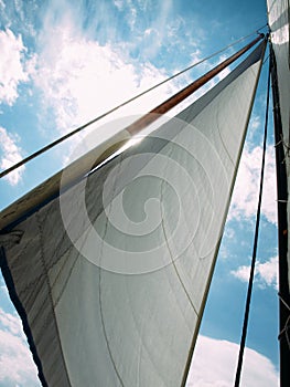 White sail against blue sky