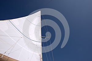 White sail against a clear blue sky