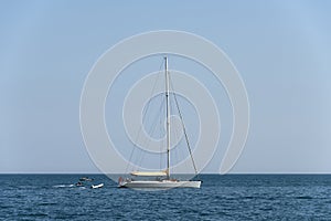 white sail boat