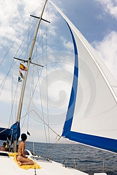 White sail and cloudy sky