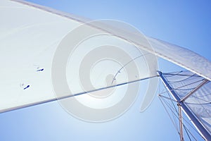 White sail of a sailing boat against sky