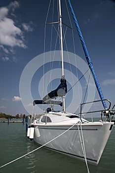 White sailboat in the harbor