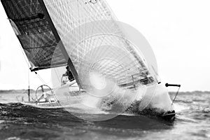 White sailboat during regatta in storm