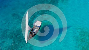 White sailboat in the sea tropical climate traditional Dhow Zanzibar boat