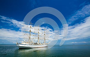 white Sailboat sky and ocean