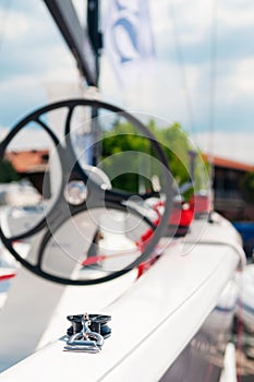 White sailboat starboard side with focus on pulley