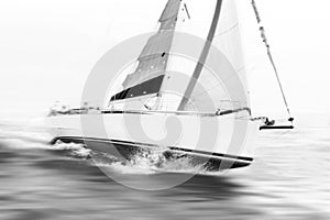 White sailboat taking speed during start