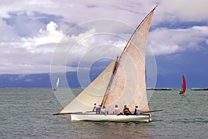 White sailed pirogue