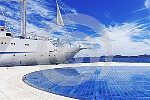 White sailing ship in the port.