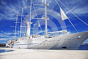 White sailing ship in the port.