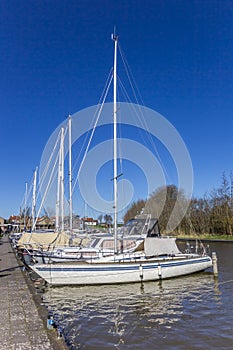 White sailing yachts in the harbor of Harlingen