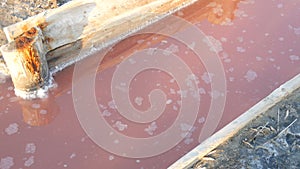 White salt deposits on the pink salt lake extraction factory Sivash in Kherson region, Ukraine