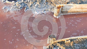 White salt deposits on the pink salt lake extraction factory Sivash in Kherson region, Ukraine