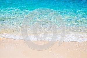 White sand beach and blue sea wave