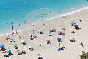 White sandÃÂ beach with colorful parasols