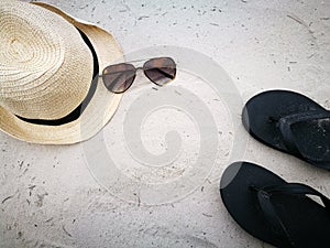 White sand beach with Hat and sun glasses at Hua Hin beach, item and accessories for summer vacation and hol