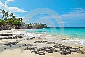 White sand beach on Hawaii Big Island with azure ocean in background